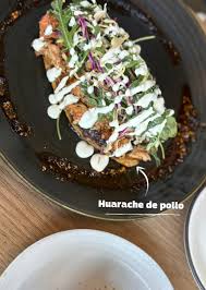 Ema signature dishes Huarache De Pollo, Puerco Mole Enchiladas, Suadero Chilaquiles, Mushroom Tetela, Guava-Queso Empanadas, and Horchata Cream Doughnut.